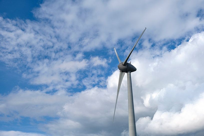 Wind turbine producing electricity in a windpark with clouds in the background by Sjoerd van der Wal Photography