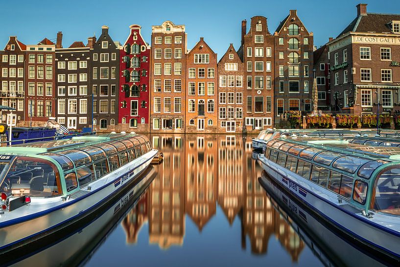 Canal houses on the Damrak in Amsterdam by Thea.Photo