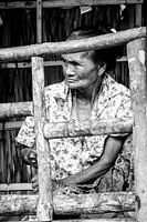 Old woman on island in Thailand black and white portrait