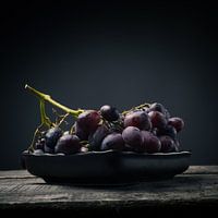 Red grapes on a wooden table
