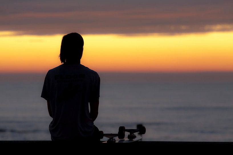 Skateboarder relaxing at sunset by Mieneke Andeweg-van Rijn