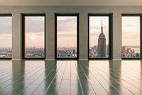 View from large windows on Manhattan / New York at evening light