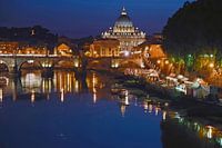 Night panorama with the Bridge of Angels and St Peter's Basilica in Rome