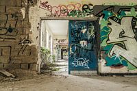 Urbex corridor with lots of graffiti