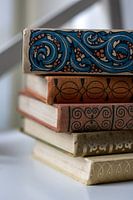 stack of vintage books with linen cover and decoration