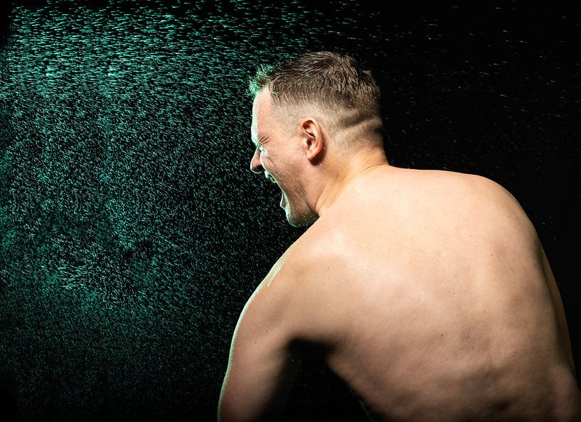 42 year old male model with naked torso, shouting towards colorf by Werner Lerooy