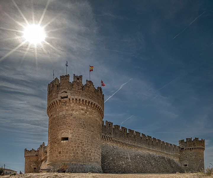 Ampudia castle in northern Spain in the sun's sidelight by Harrie Muis