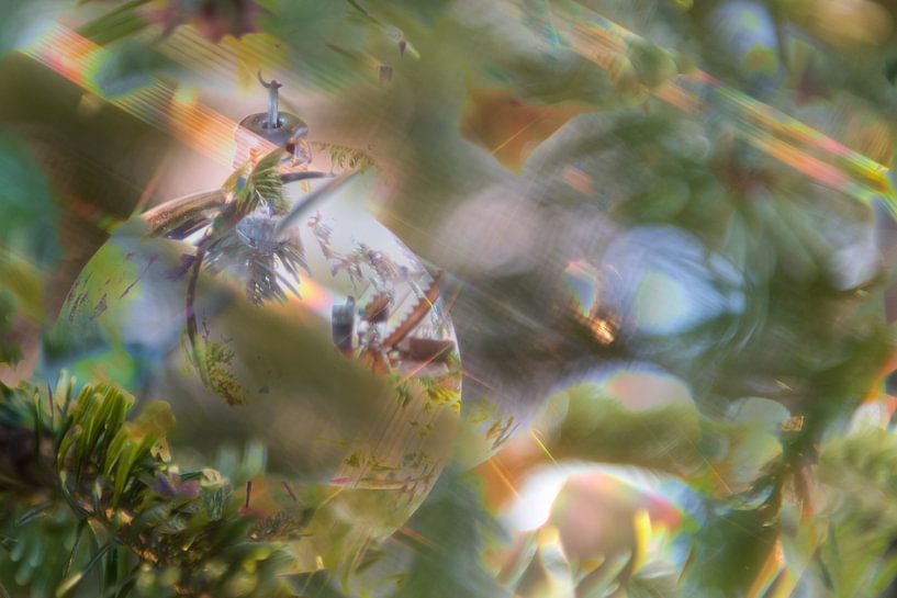 Silver coloured christmas ball with star-shaped lights by Wim Stolwerk