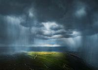 Virgas über Grasland