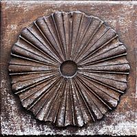 Round carvings on a door in Labeaume in France