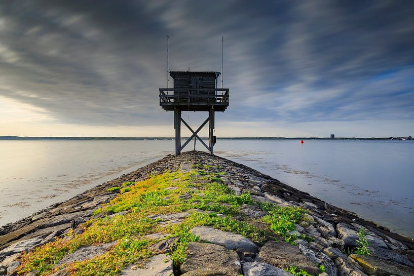 beautiful sunset behind a fisherman's house at the waterfront in Scharendijke in the province of Zee by gaps photography