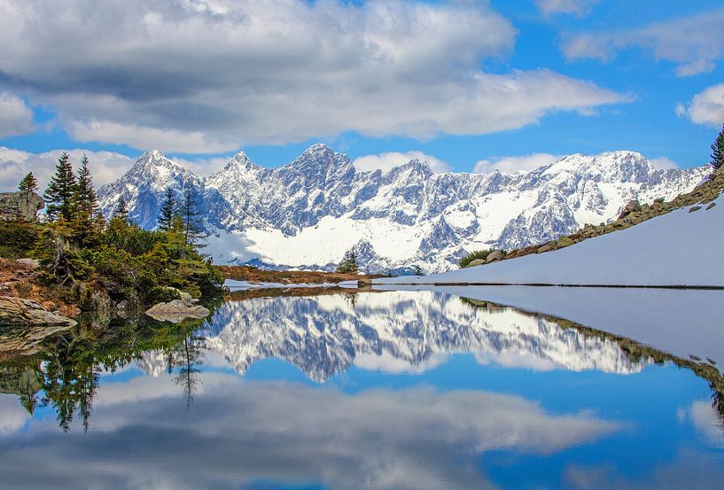Winter reflection in the mirror lake on the Reiteralm by Christa Kramer