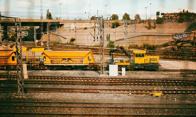 Industrial Railscape – Yellow Maintenance Train (shot through a fence) by Brave Toaster Photography