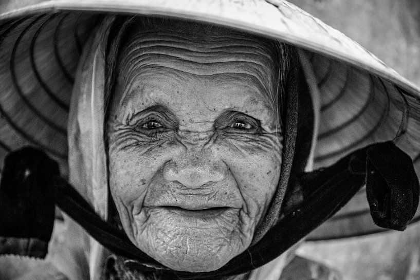 Old woman Conical Hat in Vietnam by Manon Ruitenberg