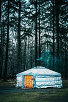 Mongolian cottage in winter landscape with plume of smoke