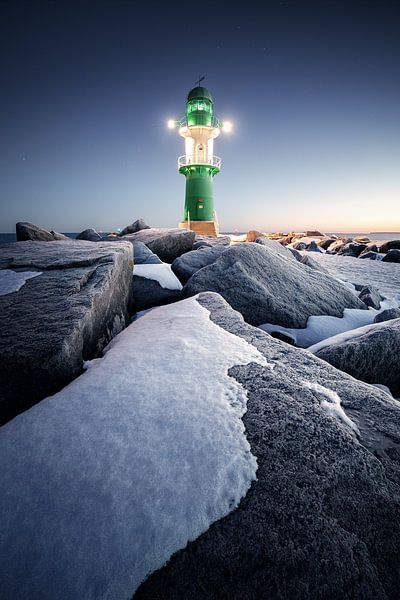 Lighthouse on the rocks by Florian Schmidt