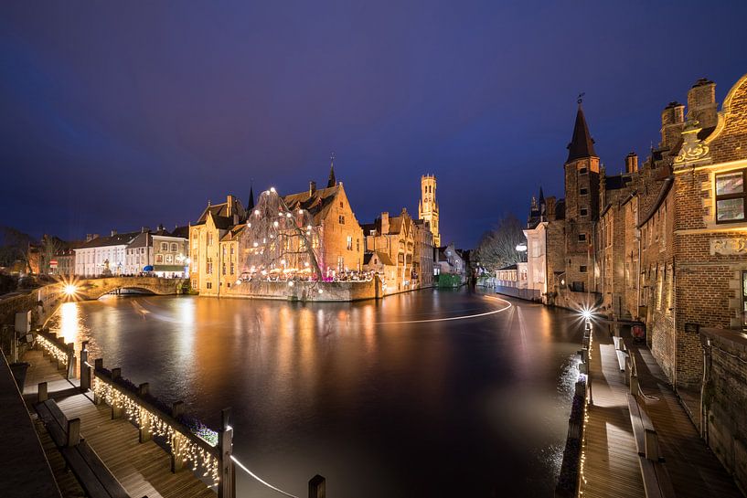 House Perez de Malvenda and Belfry of Bruges during the Christmas period by Marcel Derweduwen