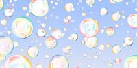 Floating soap bubbles on blue