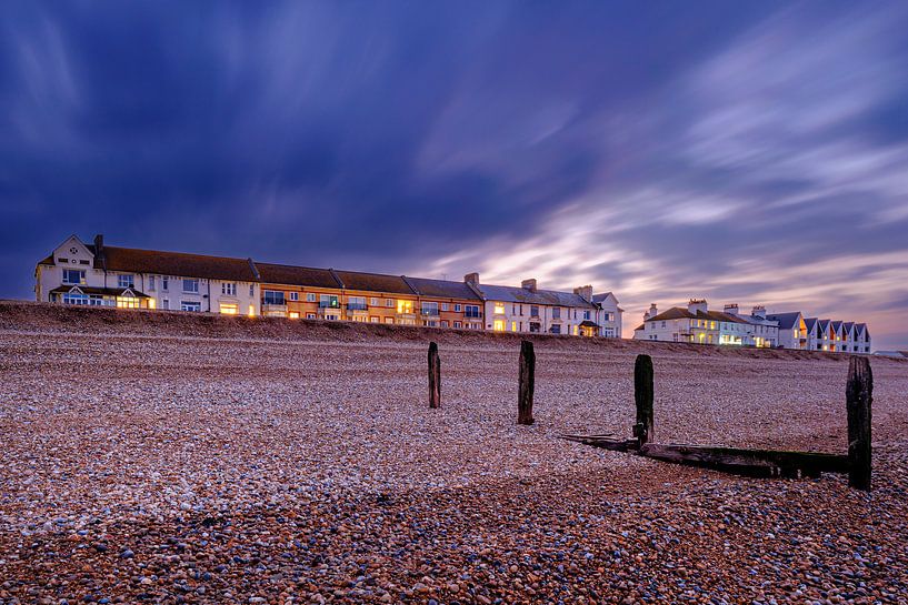 Pebble beach with ruined breakwater at Littlestone-on-Sea in England by Evert Jan Luchies