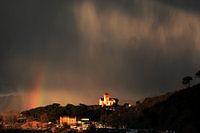 Storm and rainbow in the mountains of Montcada Spain