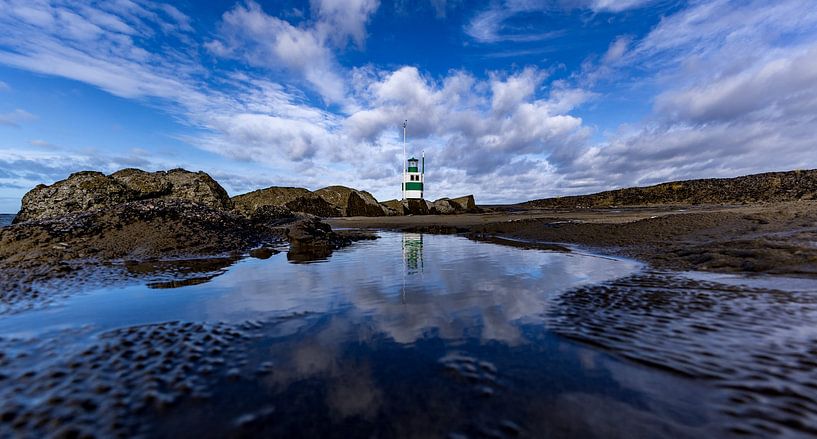 Lighthouse reflection on the South Pier by peterheinspictures