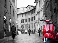 Red Vespa Piaggio in atmospheric Italian street
