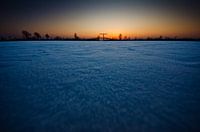 Frozen Nieuwkoop lakes at sunset