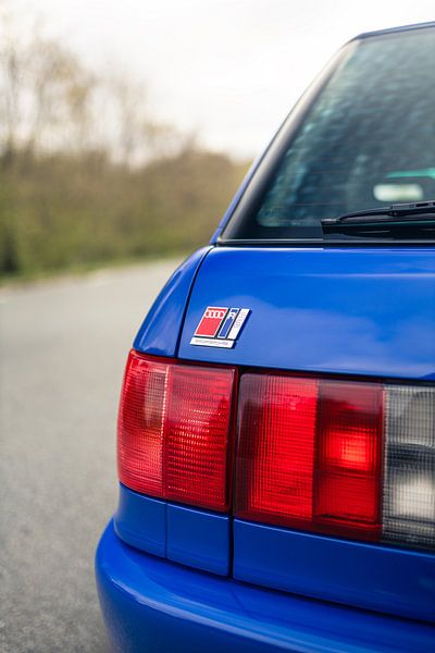 Blue Audi RS2 on Long Road by Historic Wall by Sebastiaan van 't Hoog