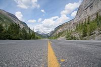 Empty road through Rocky Mountains