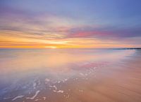 A sunset scene with pastel shades on the beach at Zoutelande, Zeeland
