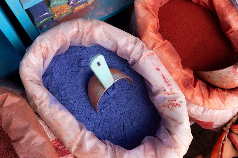 bags of paint pigment in different colours for sale at a Moroccan street market. Chefchaouen by Tjeerd Kruse