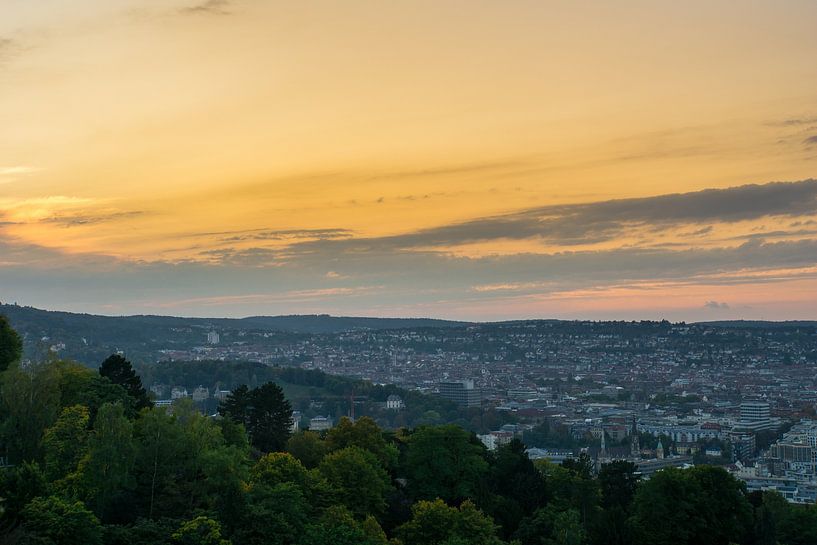 Wide view over the roofs of the city of stuttgart from above at sunset by adventure-photos