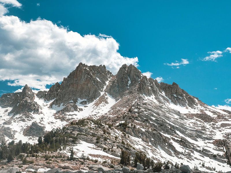 Snow cover in rough mountain terrain by Marc van den Elzen
