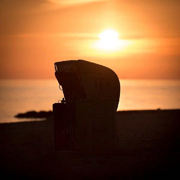 Beach chair in the sunrise by the sea on the Baltic Sea by Voss photography