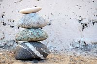 Zen pile of stones and boulders with an old background
