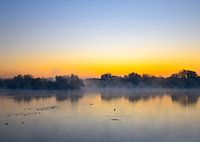 Zonsopkomst en een laaghangende mist