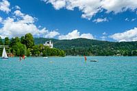 A view of the shoreline landscape of Lake Woerthersee in Austria.