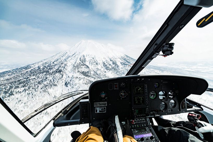 Helicopter flight along the crater of a high volcano in Japan 2018. by Hidde Hageman