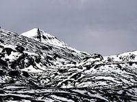 Fresh snow turns a mountain into a zebra