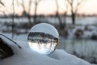 Sunrise with a lens ball in the snow