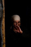 Woman laughing in refugee camp | Portrait photography art print