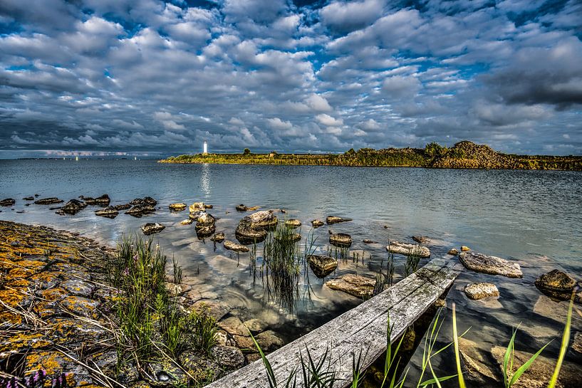 Lighthouse in the evening light at Breezanddijk by Harrie Muis