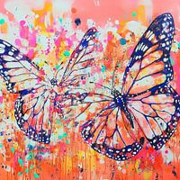 Deux papillons dans une explosion d'énergie colorée