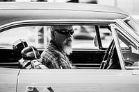 Man with beard in Plymouth Roadrunner
