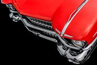 Front view of a classic american retro car. Clearly visible is the shiny chrome and the large headli