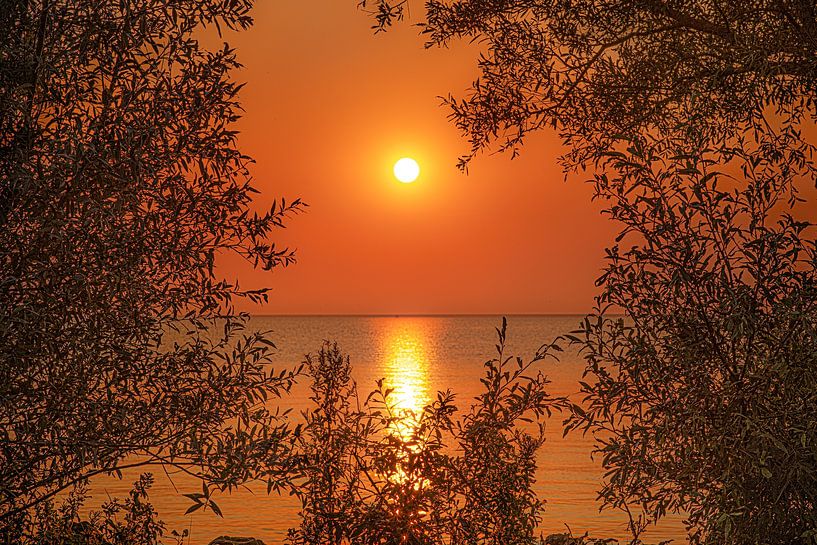 Sunset over the IJsselmeer from the Frisian town of Makkum by Harrie Muis