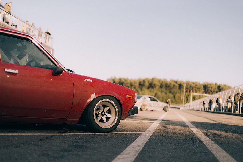 Red Toyota Corolla oldtimer side view at sunset by avwijk.visuals