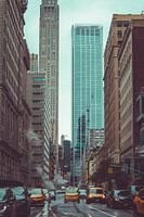 Yellow cab drives through Church St. in New York City