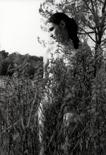 Young woman half covered naked in nature. by Cor Heijnen
