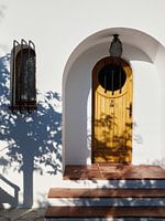 Illuminated in front of a closed door